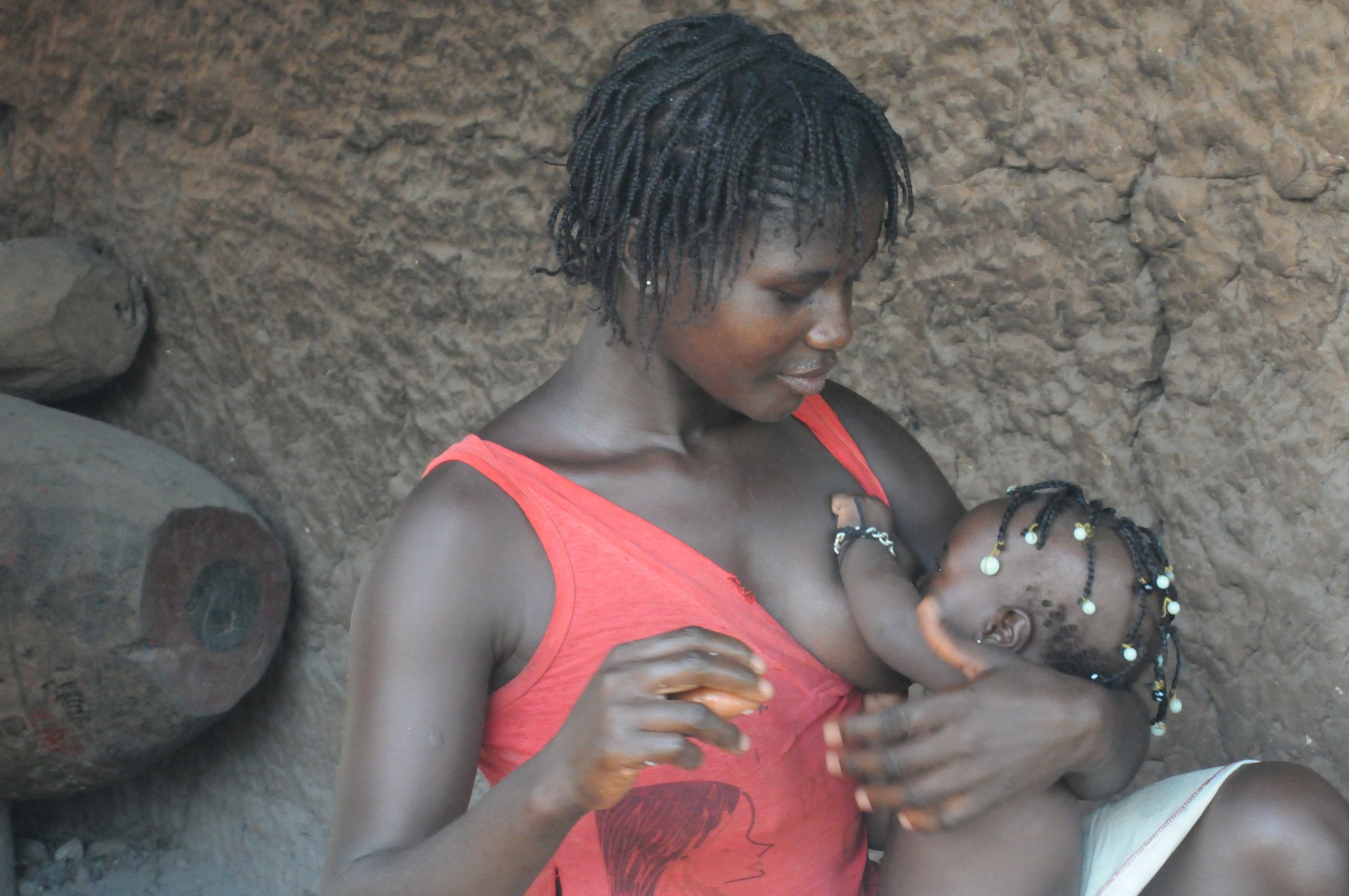 Black African woman breastfeeding her baby