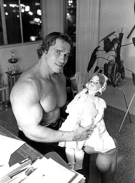 Arnold Schwarzenegger with a doll...