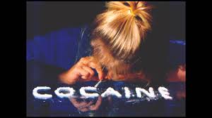 Blonde girl snorting cocaine, white powder, letters