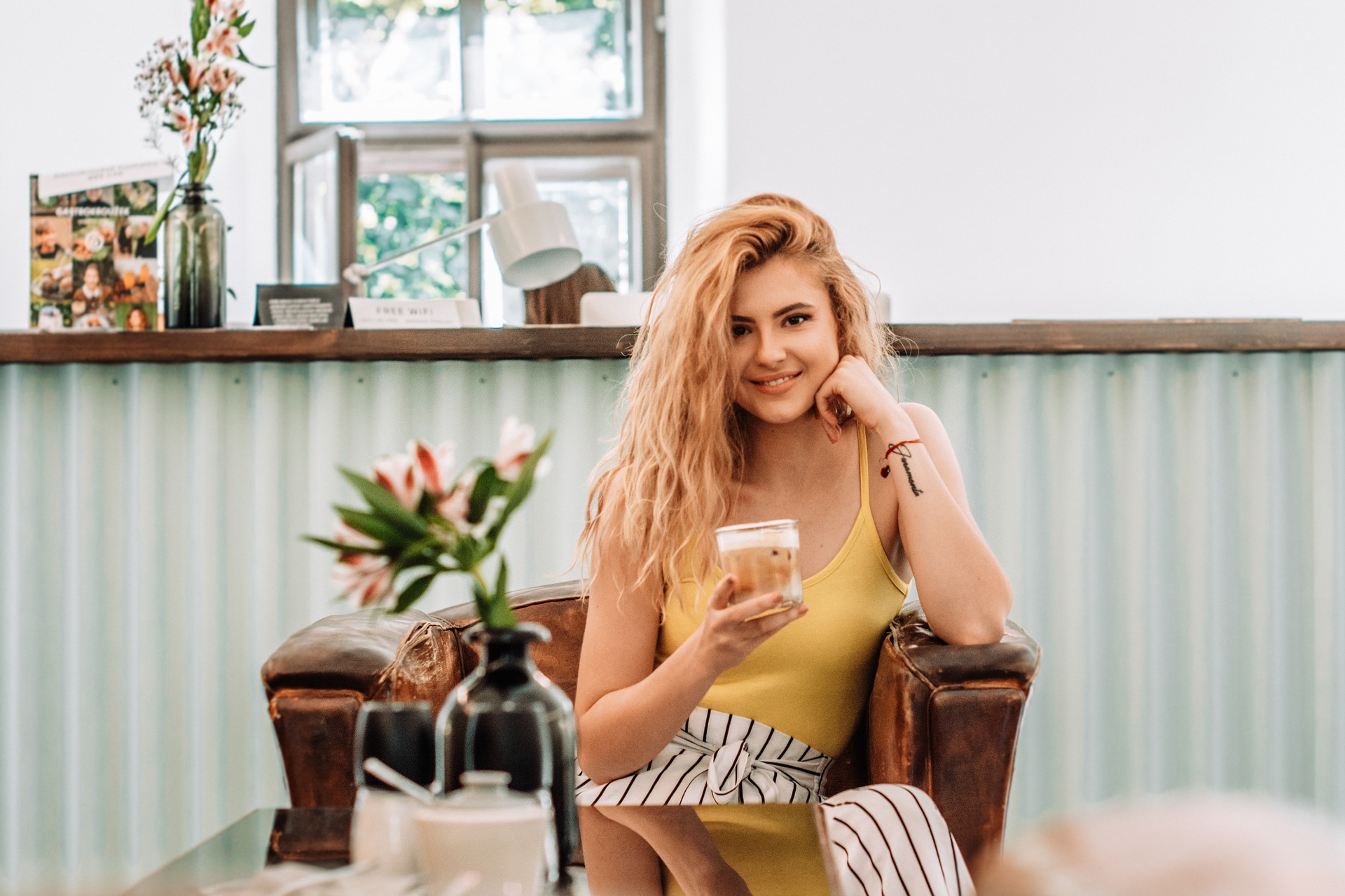 Blonde woman drinking coffee