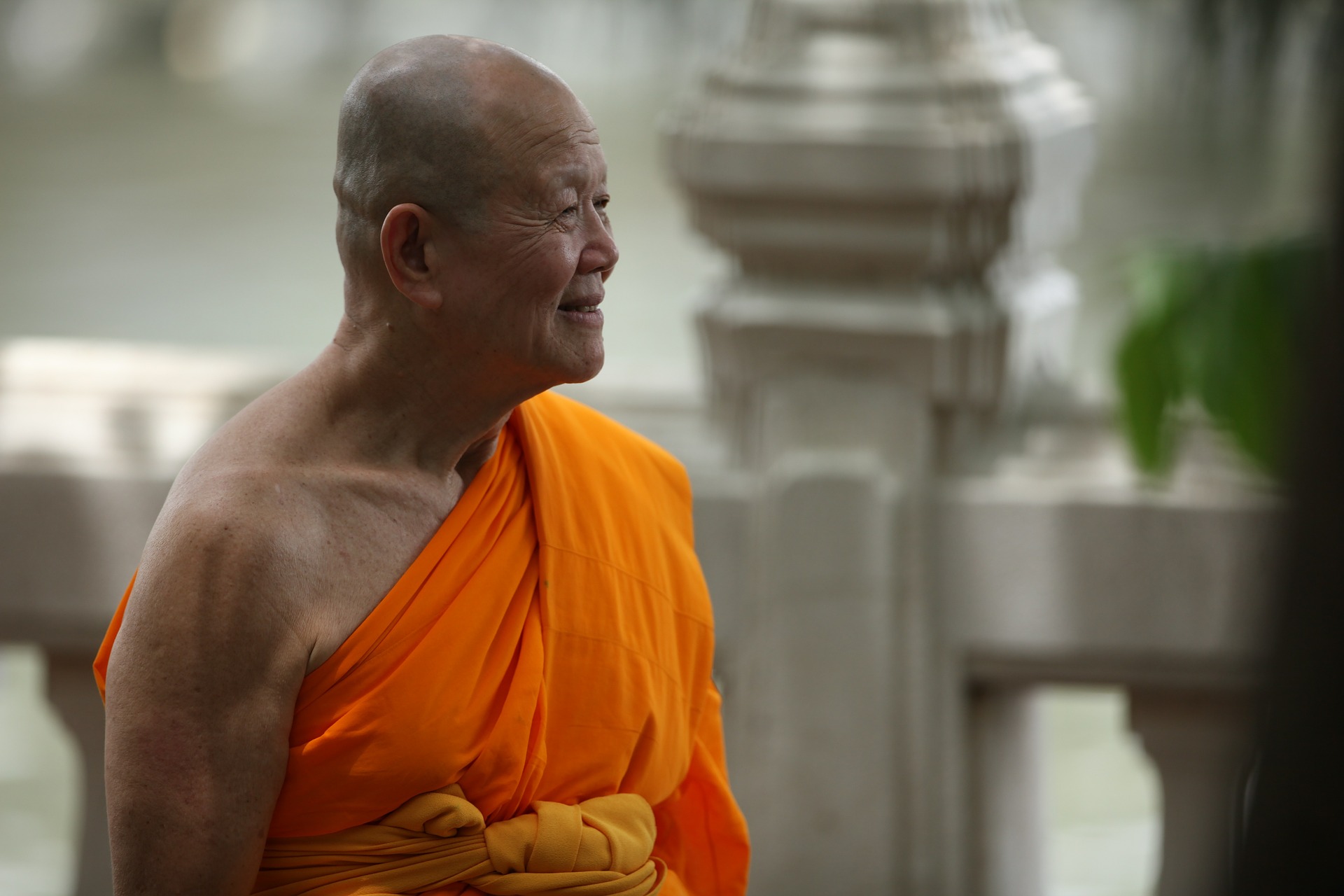 Buddhist zen monk in orange from Thailand