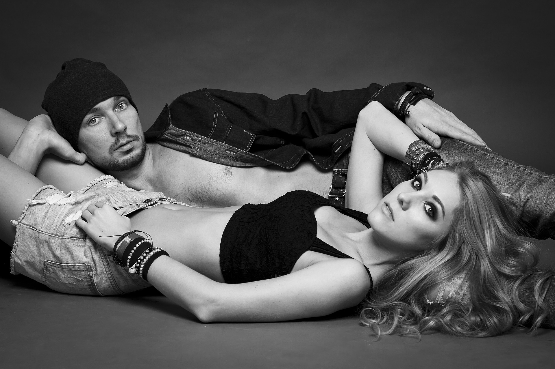 Sexy couple, man, woman, looking into camera, bodies