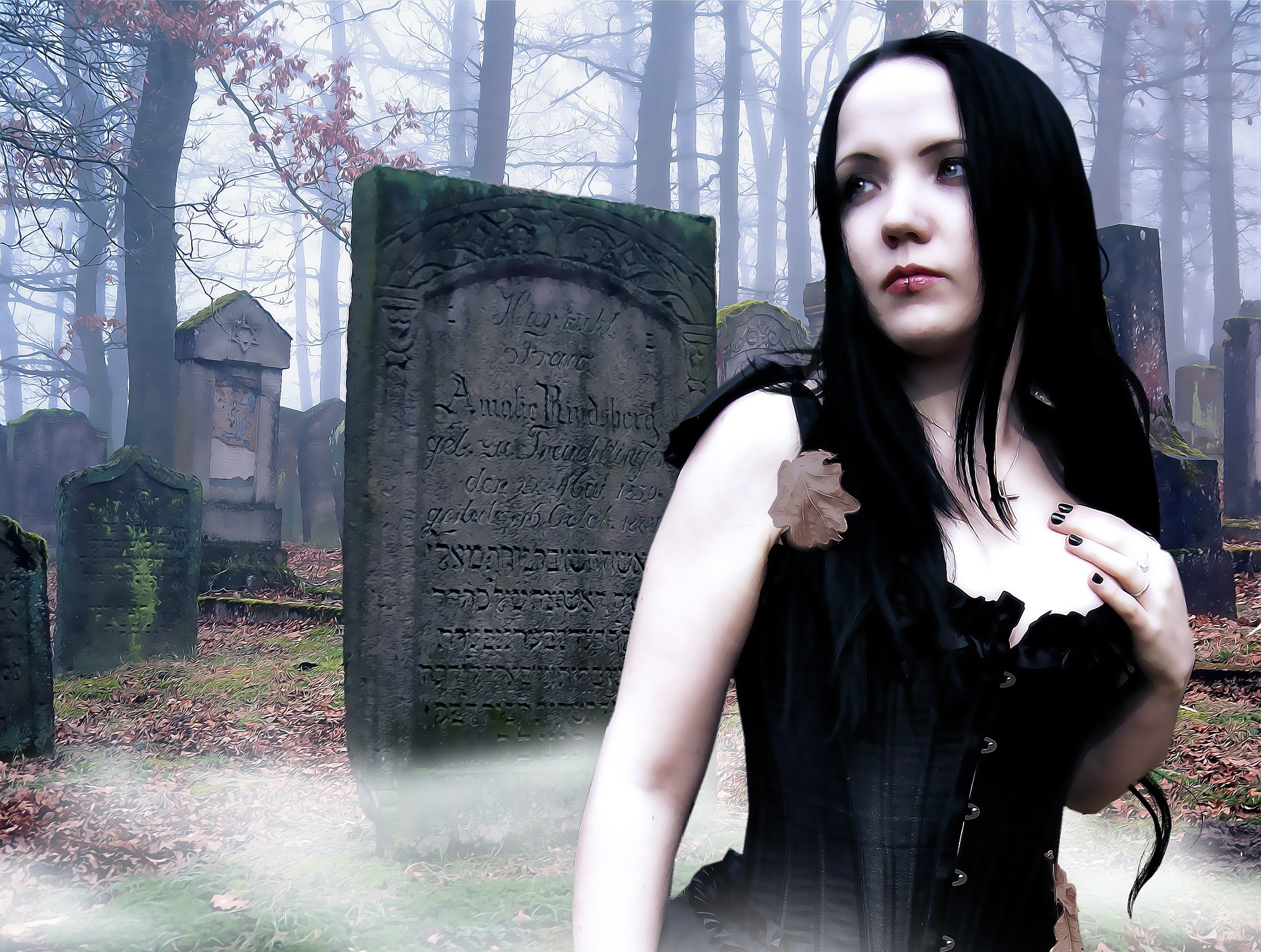 Gothic black model on cemetery with gravestones