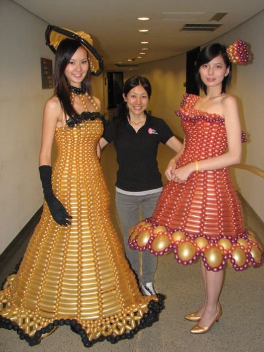 Women with balloon dresses.