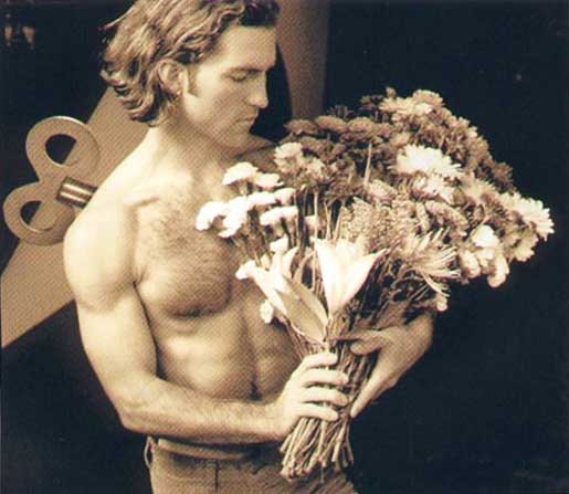 Man with flowers. Mann mit blumen.
