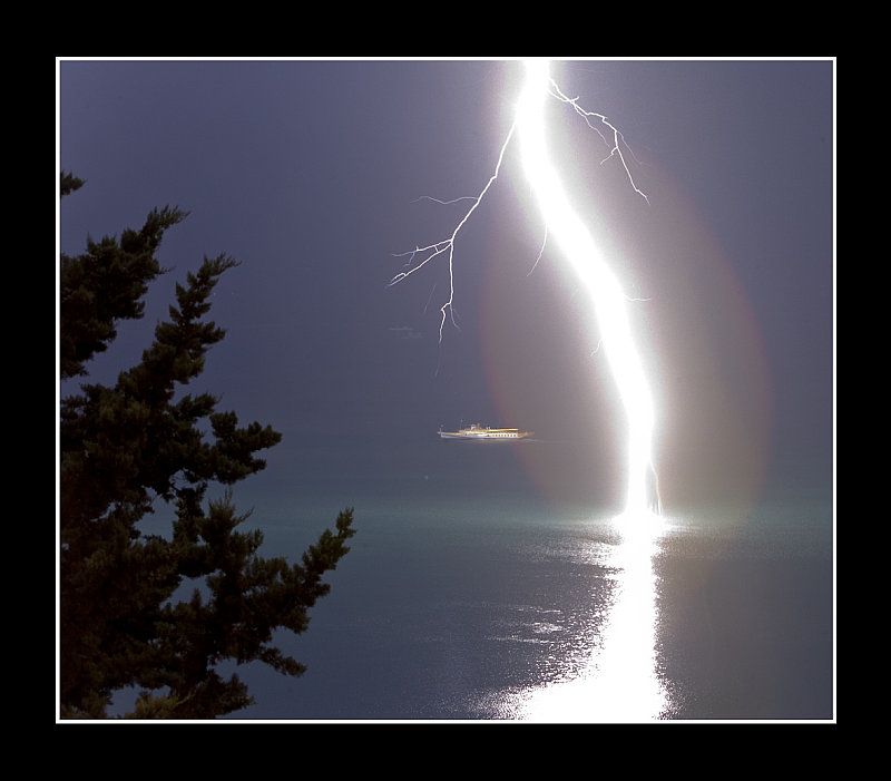 Lightning in a lake. (c) Thierry Galeuchet