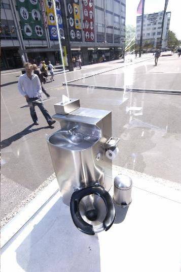 Monica Bonvicini's public glass transparent toilet.