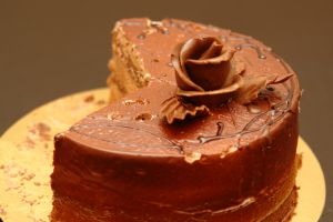 Cake with rose on chocolate.