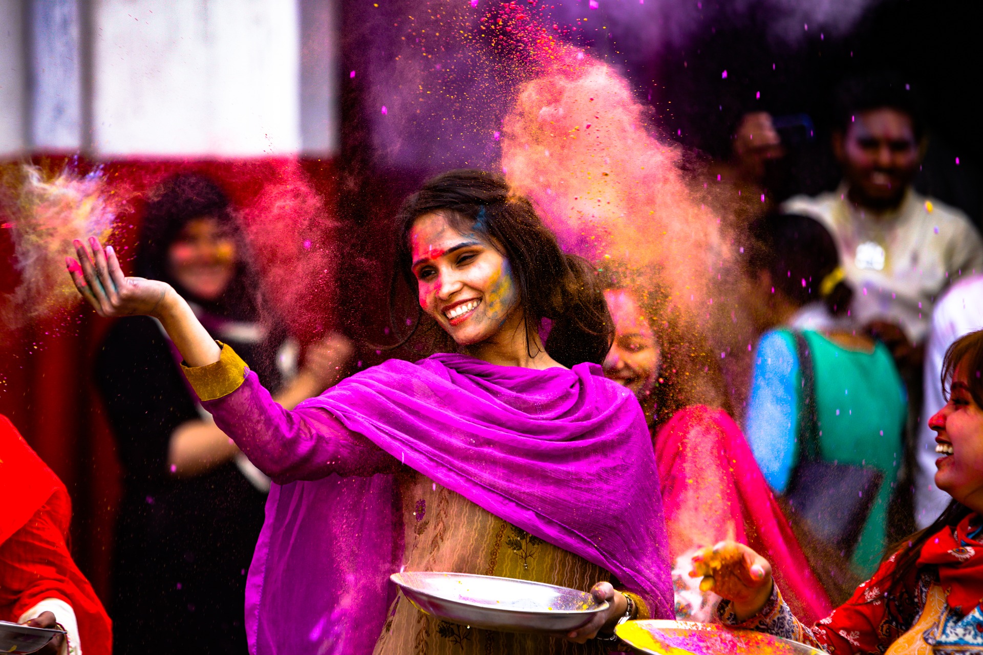 Indian girl full of color at Holi festival