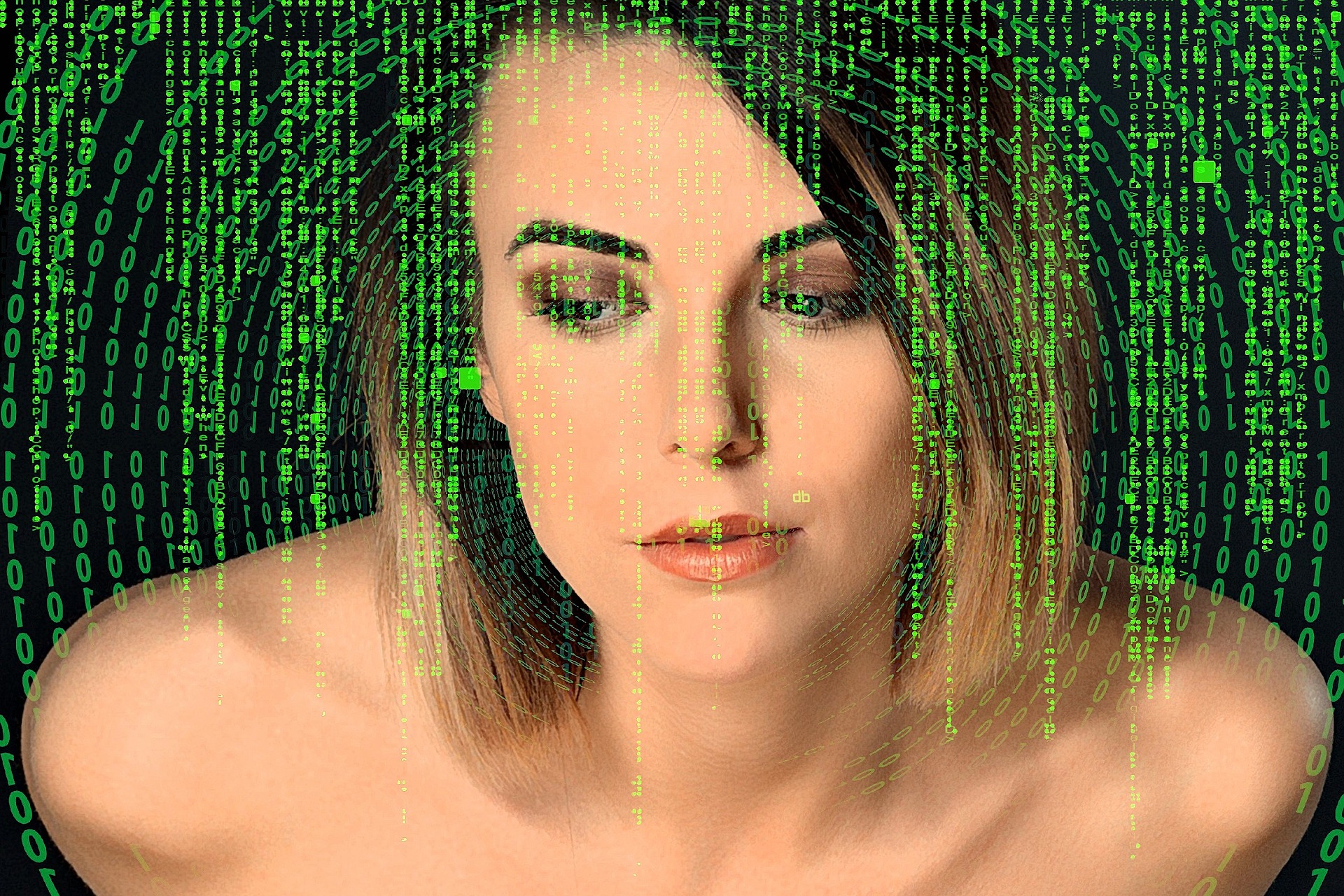 Blonde nameless woman in front of green matrix numbers