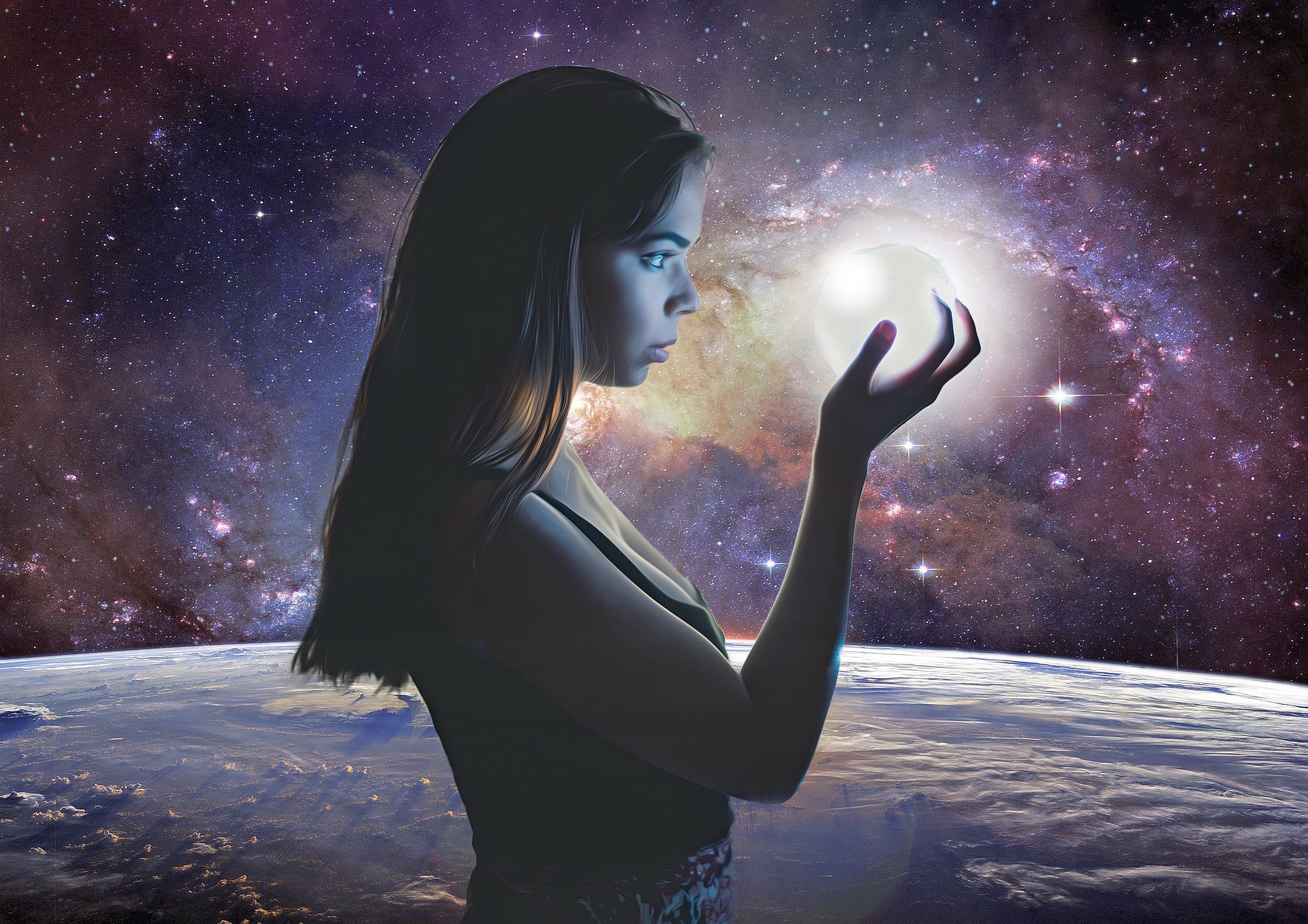 Woman with galaxies in hand: Universe and planets