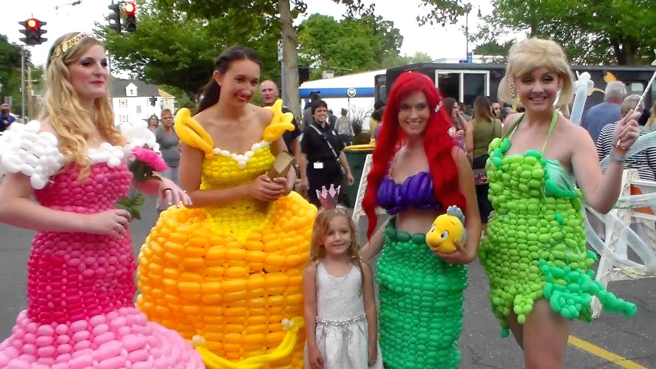 Women with fashion-dresses made out of balloons