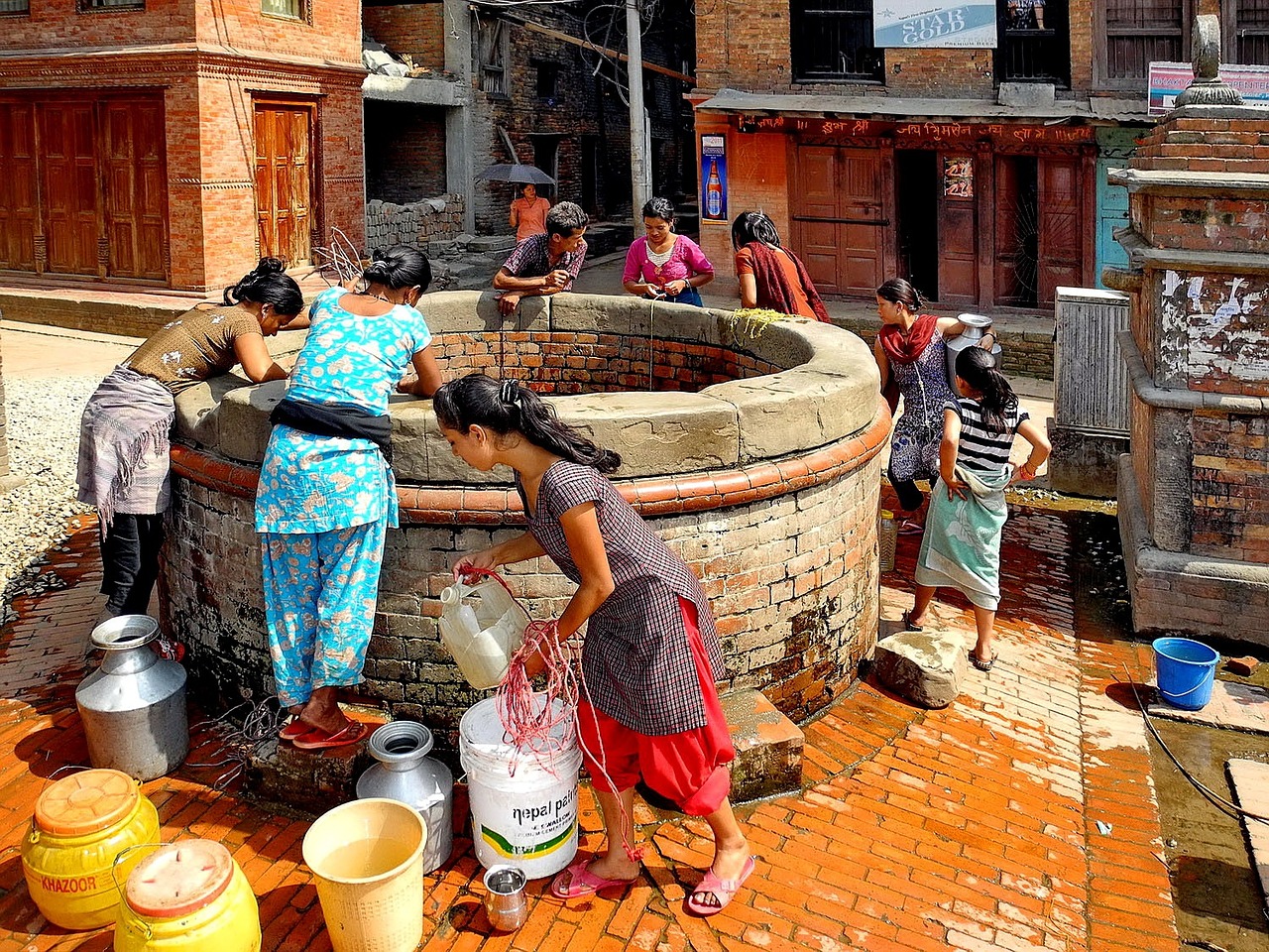 Women washing clothes in well - Nepal